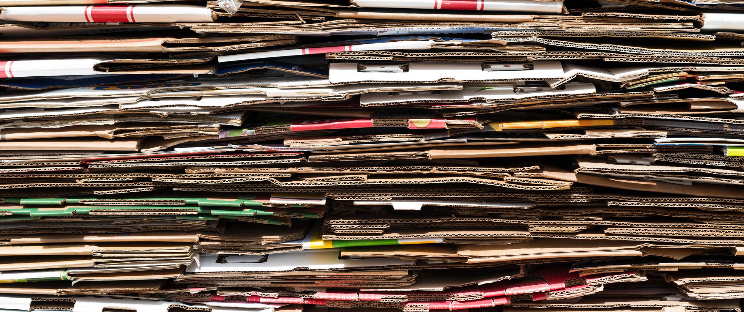 Close-up of discarded cardboard boxes folded flat